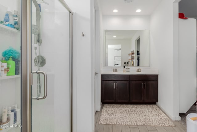 bathroom with vanity and walk in shower