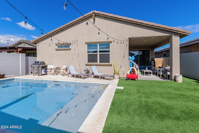 back of property featuring a yard and a patio area