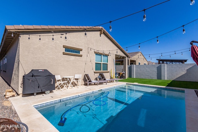 exterior space with grilling area and a patio