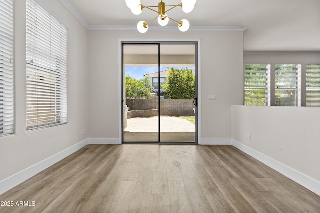 3575 E Gary Way, Gilbert, AZ 85234 - unfurnished dining area featuring a chandelier, crown molding, and wood finished floors