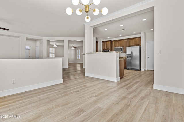3575 E Gary Way, Gilbert, AZ 85234 - kitchen featuring stainless steel appliances, ceiling fan, open floor plan, brown cabinets, and recessed lighting