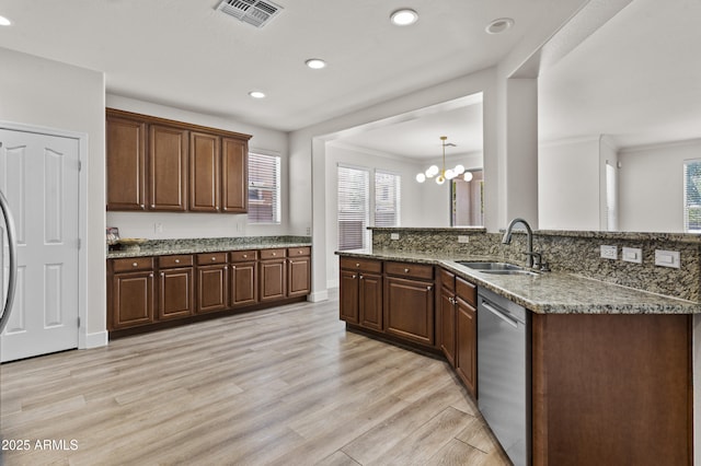 3575 E Gary Way, Gilbert, AZ 85234 - kitchen with stainless steel dishwasher, recessed lighting, plenty of natural light, light wood finished floors, and a chandelier