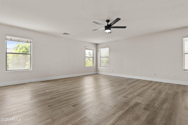 3575 E Gary Way, Gilbert, AZ 85234 - empty room featuring wood finished floors, a ceiling fan, and plenty of natural light