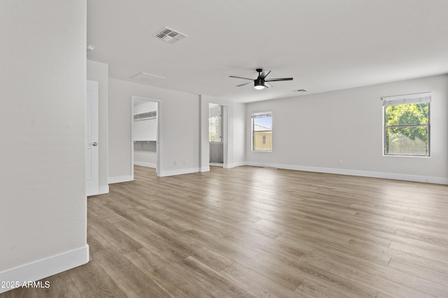 3575 E Gary Way, Gilbert, AZ 85234 - unfurnished living room featuring ceiling fan and light wood-style floors