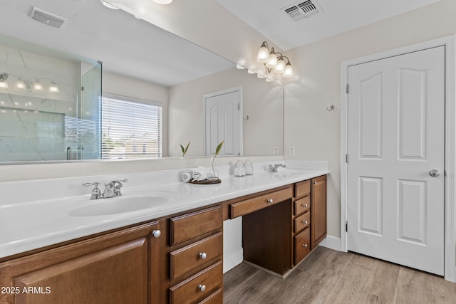 3575 E Gary Way, Gilbert, AZ 85234 - full bath with double vanity, a shower with shower door, and wood finished floors