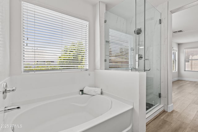 3575 E Gary Way, Gilbert, AZ 85234 - bathroom with a garden tub, a stall shower, wood finished floors, and radiator