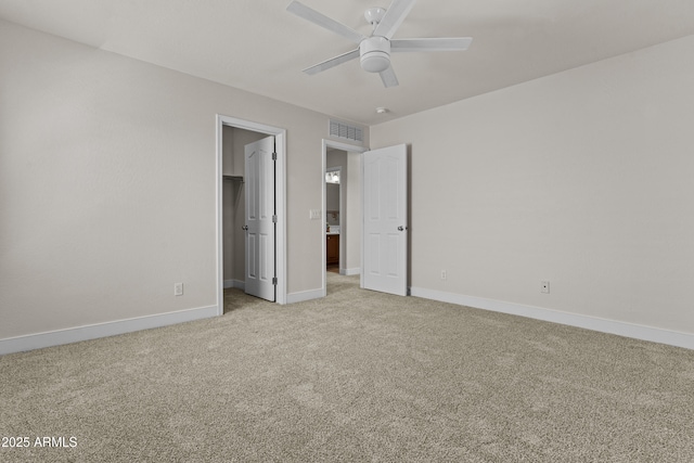 3575 E Gary Way, Gilbert, AZ 85234 - unfurnished bedroom featuring light carpet, a spacious closet, a ceiling fan, and a closet