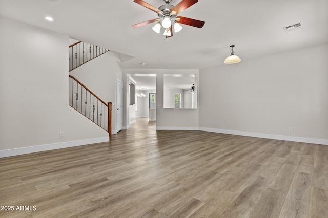 3575 E Gary Way, Gilbert, AZ 85234 - unfurnished living room with a ceiling fan, light wood-style flooring, stairway, and recessed lighting