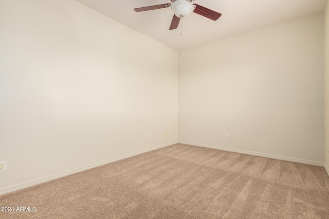 carpeted empty room with ceiling fan