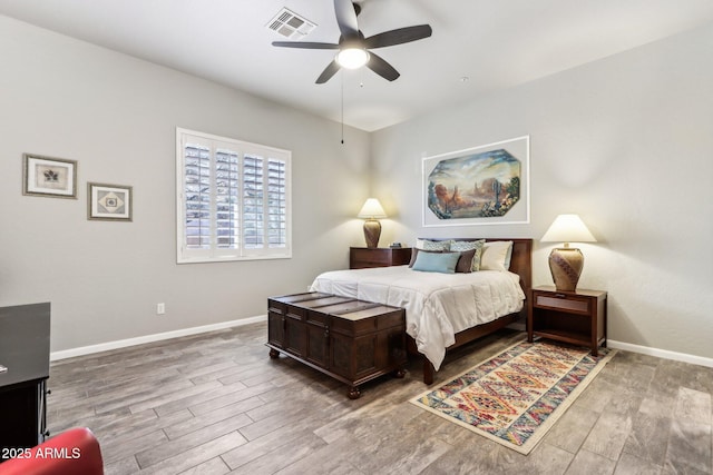 bedroom featuring hardwood / wood-style floors and ceiling fan