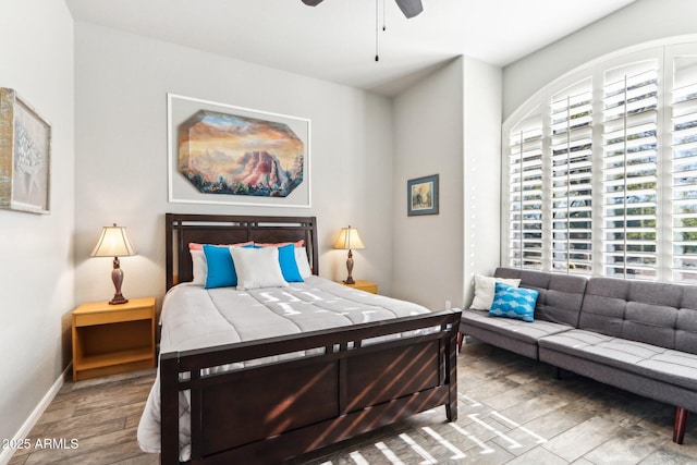 bedroom with ceiling fan and wood-type flooring