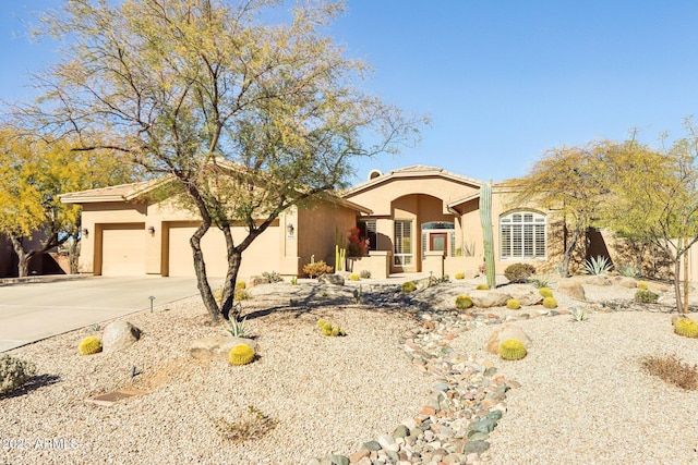 view of front of home with a garage