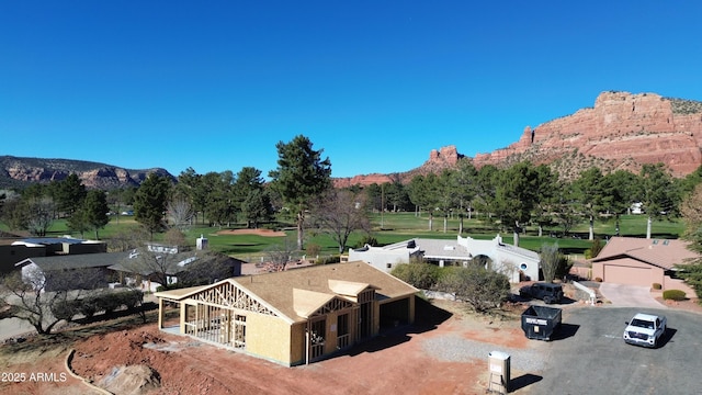 birds eye view of property with a mountain view