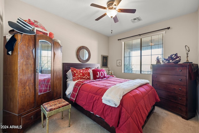 bedroom featuring ceiling fan and light colored carpet