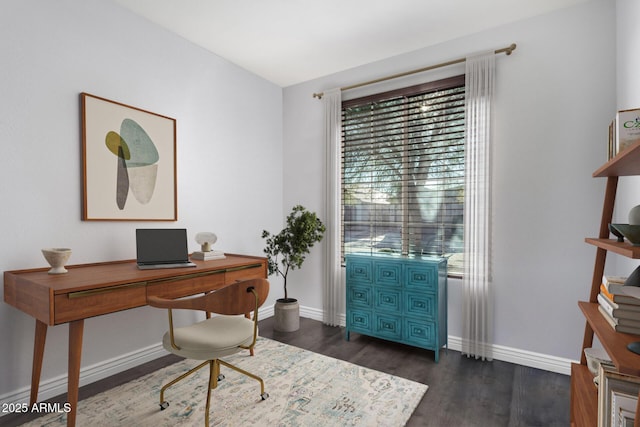 office space with baseboards and dark wood-style flooring