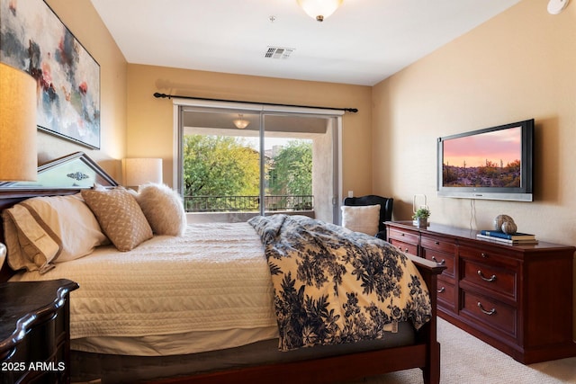 carpeted bedroom with access to outside