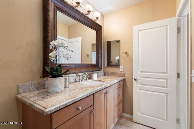 bathroom featuring tile patterned floors and vanity