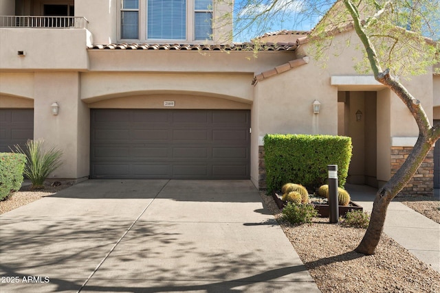 view of front of home featuring a balcony and a garage