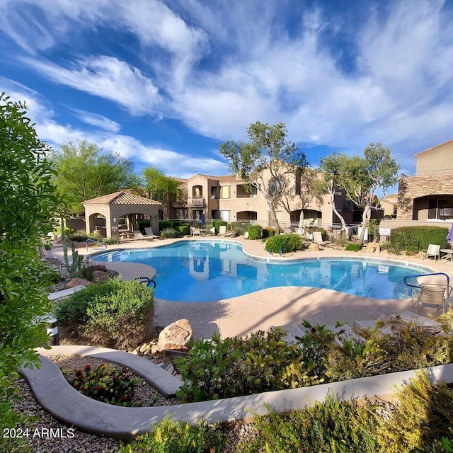 view of swimming pool with a gazebo and a patio