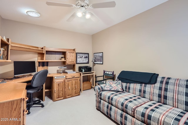 office area featuring light carpet and a ceiling fan