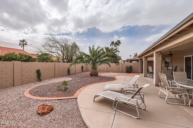 view of patio featuring ceiling fan and a fenced backyard