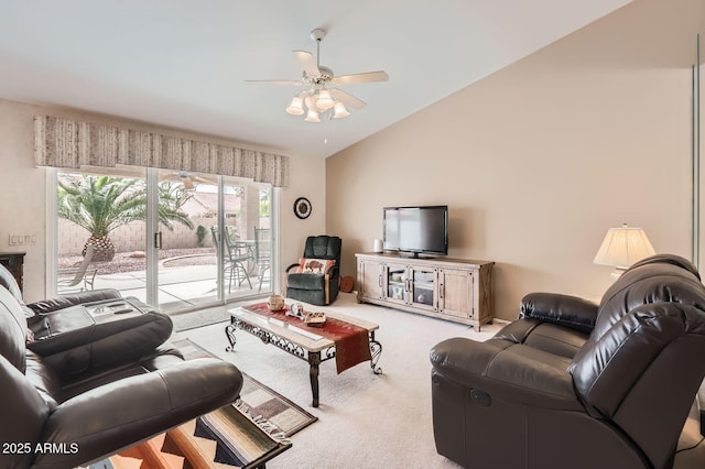 living room with lofted ceiling, carpet, and ceiling fan