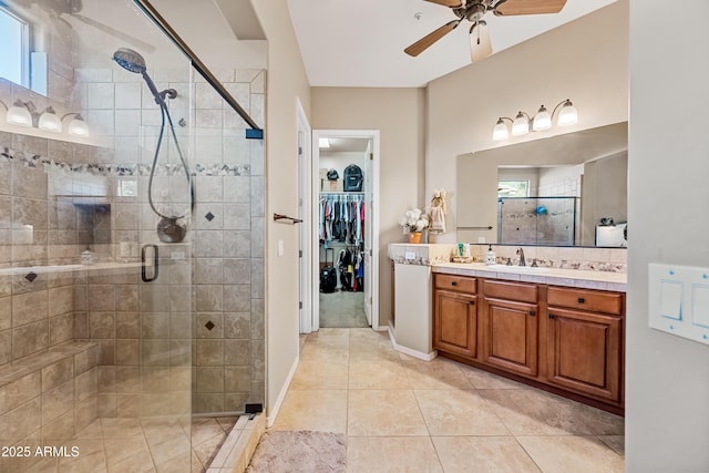 bathroom featuring ceiling fan, tile patterned floors, vanity, and a shower with shower door