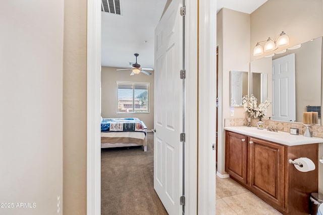 bathroom featuring tile patterned floors and vanity