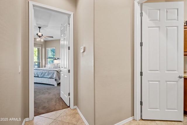 hallway with light tile patterned floors