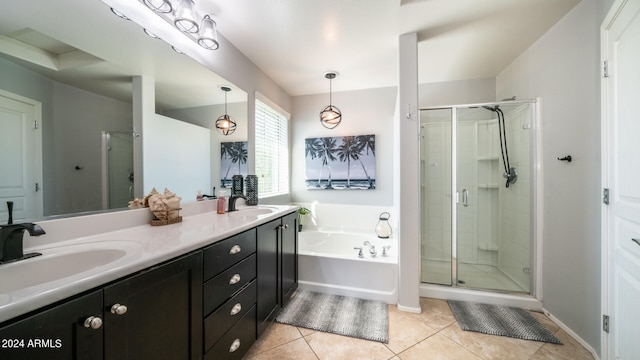 bathroom featuring tile patterned flooring, vanity, and plus walk in shower