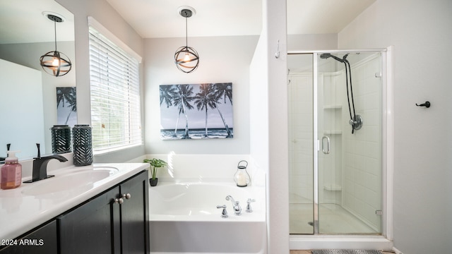 bathroom featuring vanity and separate shower and tub