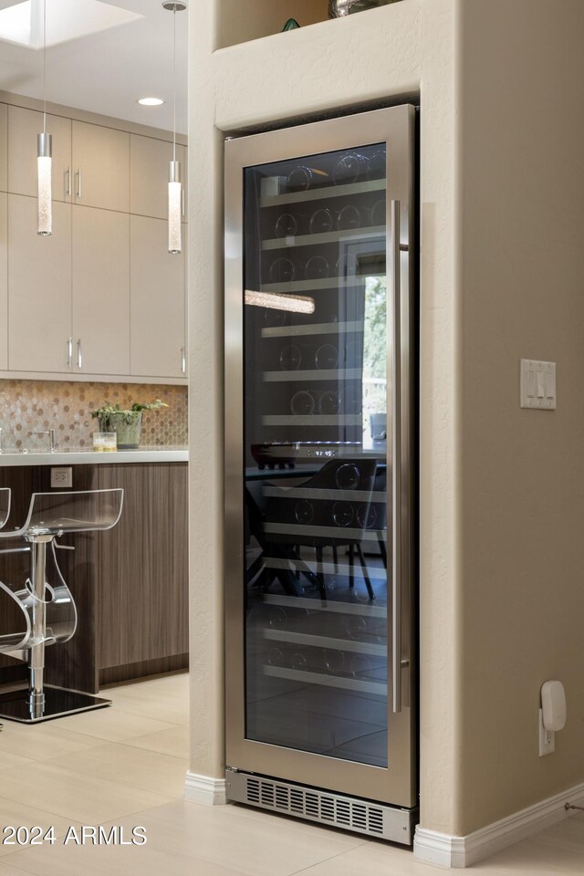 utility room with wine cooler