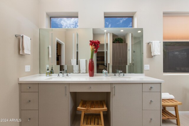 bathroom featuring an enclosed shower and vanity