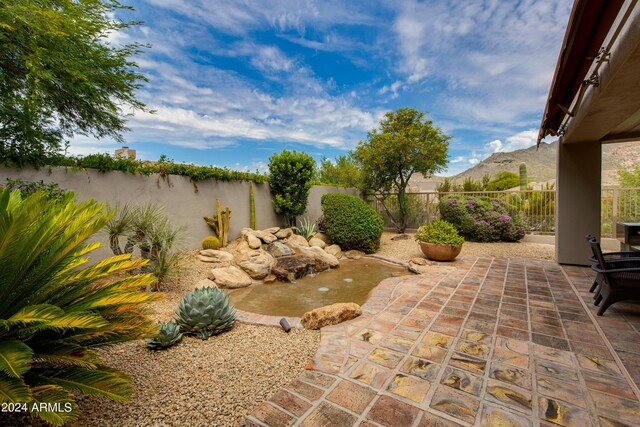 view of patio / terrace with a mountain view