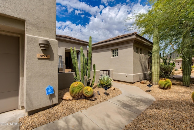 view of side of property with stucco siding