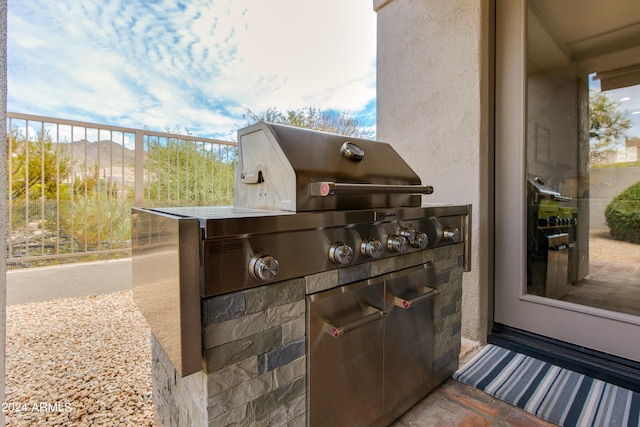 view of patio / terrace featuring exterior kitchen