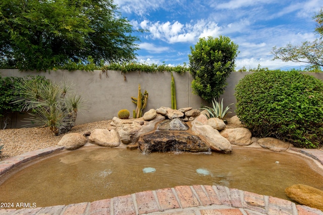 exterior details featuring a fenced backyard