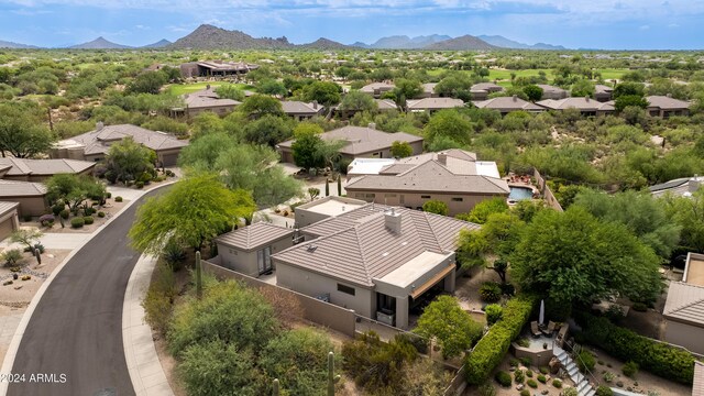 birds eye view of property featuring a mountain view