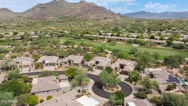 birds eye view of property with a mountain view