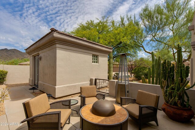 view of patio / terrace with a mountain view and an outdoor hangout area