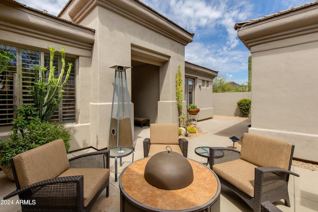 view of patio featuring fence