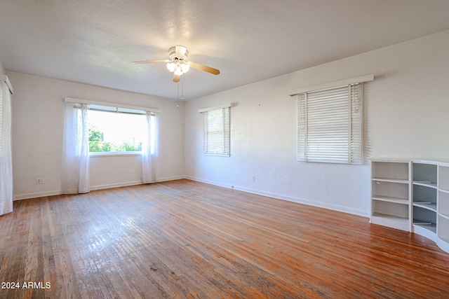 empty room featuring ceiling fan and light wood-type flooring