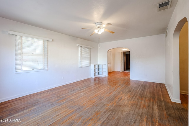 spare room featuring hardwood / wood-style floors and ceiling fan