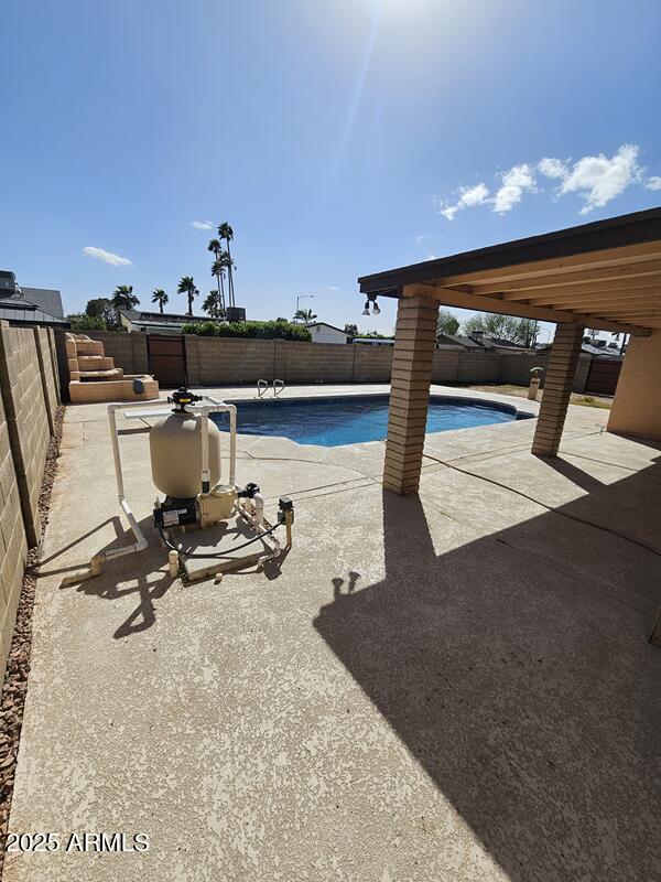 view of swimming pool featuring a patio area, a fenced backyard, and a fenced in pool