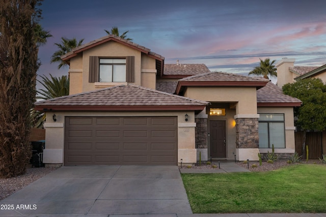 view of front property with a lawn and a garage