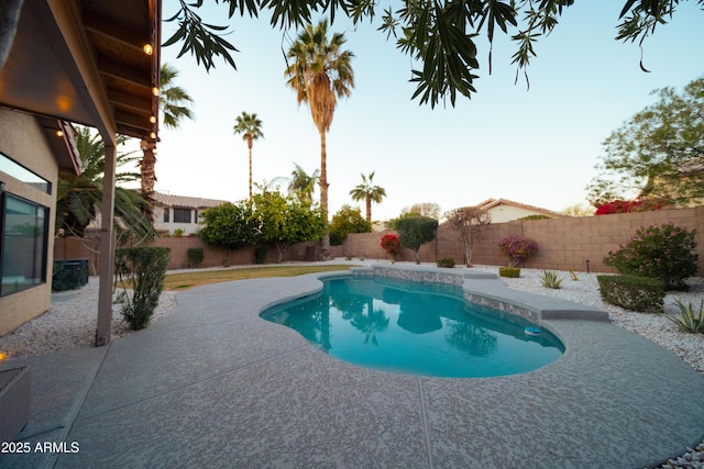 view of swimming pool with a fenced in pool, a fenced backyard, and a patio