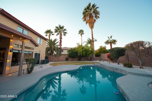 view of swimming pool featuring a fenced backyard and a fenced in pool