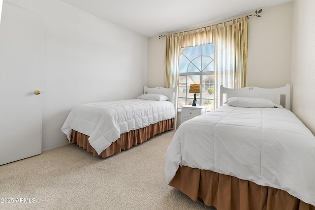 bedroom featuring light carpet