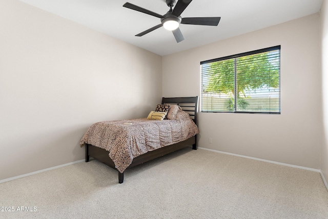 bedroom featuring carpet floors, baseboards, and ceiling fan