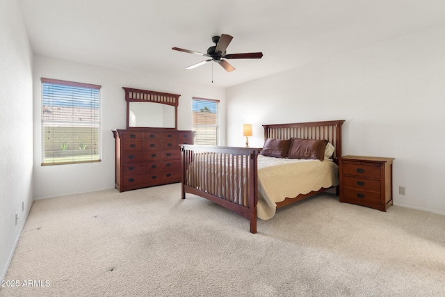 bedroom featuring multiple windows, carpet flooring, and ceiling fan